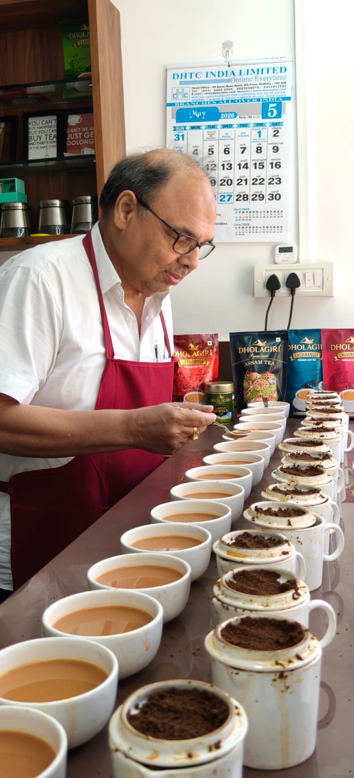 Shri Rajeev Nayan Ghuwalewala tasting tea samples at the Dholagiri cupping table
