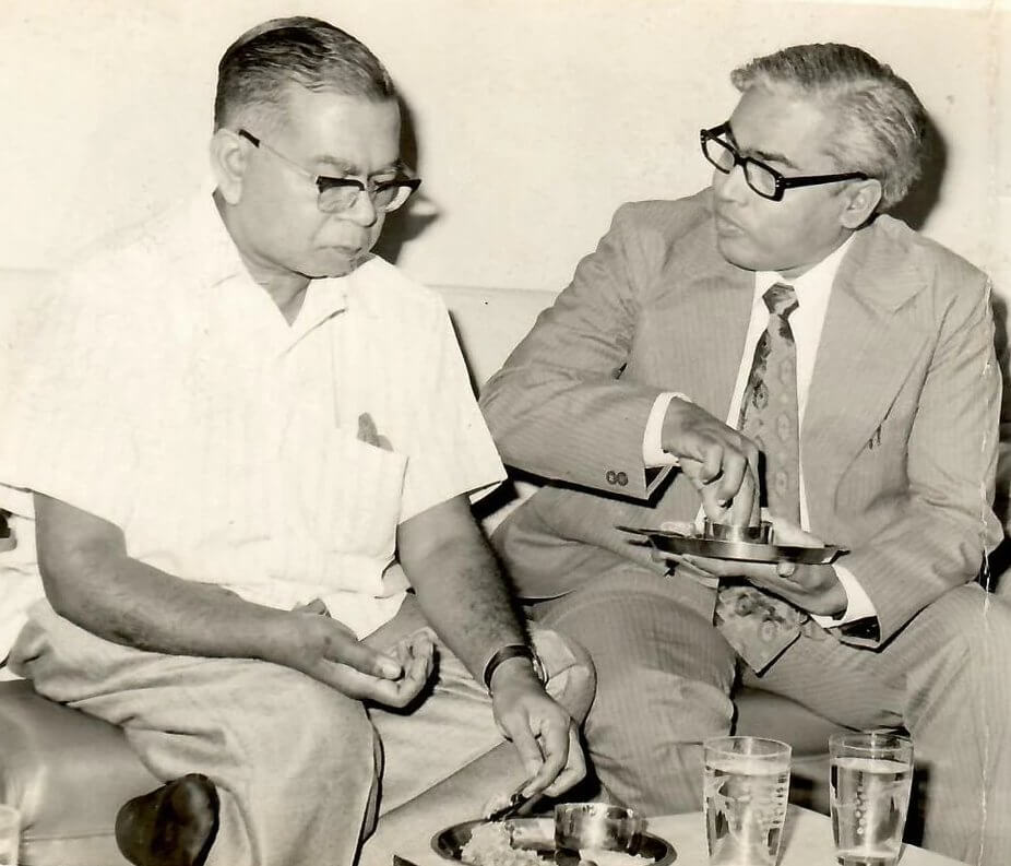 Shri S. P. Ghuwalewala sharing tea with a respected guest at the Dholagiri offices